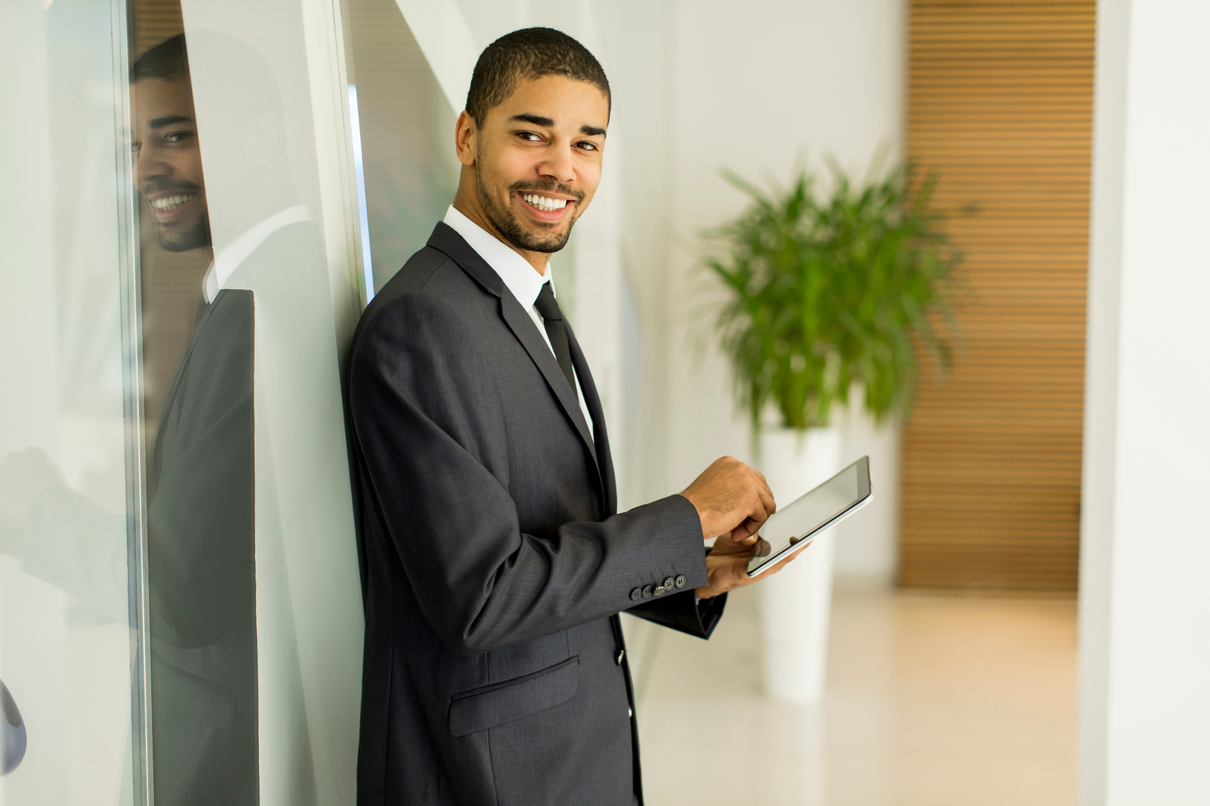 Young Black Man with Tablet in the Office